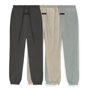 Fear of God Essentials Crinkle Nylon Trackpant フィアオブゴッド エッセンシャルズ クリンキー ナイロン トラックパンツ 3色（Fear of God 10）